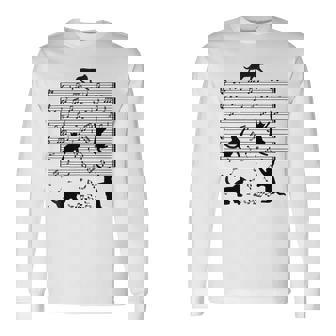 音楽譜上の遊ぶ猫のシルエットデザイン ピアノ音符 遊び心のある猫 猫 ジョーク かわいい 動物好き ギャグ好き 長袖Tシャツ - Kawaiitshirt