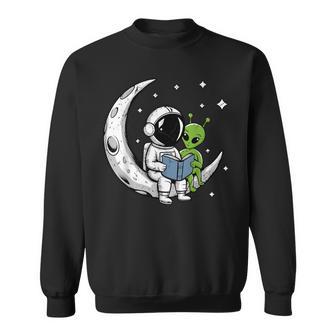 Astronaut Reading Book To Alien Moon Space Astronomy Sweatshirt - Monsterry