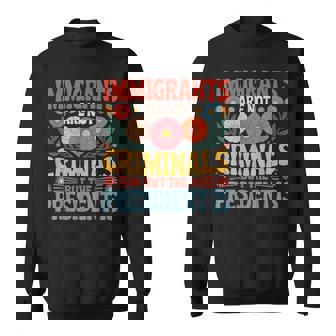 Immigrants Are Not Criminals The President Is Feminist Sweatshirt - Thegiftio