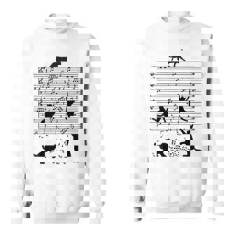 音楽譜上の遊ぶ猫のシルエットデザイン ピアノ音符 遊び心のある猫 猫 ジョーク かわいい 動物好き ギャグ好き スウェットシャツ - Kawaiitshirt