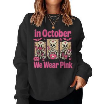 In October We Wear Pink Nurse Skeleton Breast Cancer Women Sweatshirt - Thegiftio UK