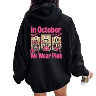 In October We Wear Pink Nurse Skeleton Breast Cancer Women Oversized Hoodie Back Print - Thegiftio UK