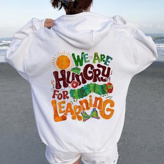 We Are Hungry For Learning Teacher First Day Back To School Women Oversized Hoodie Back Print - Thegiftio UK