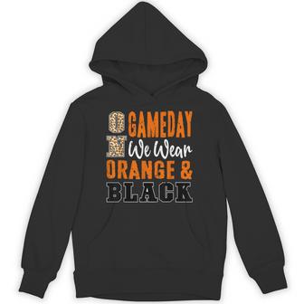 On Gameday Football We Wear Orange And Black School Spirit Hoodie - Thegiftio UK