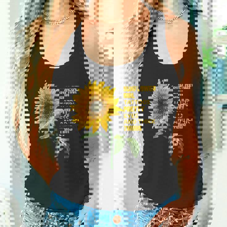 ひまわりガール タトゥー かわいい目 太腿 タンクトップ