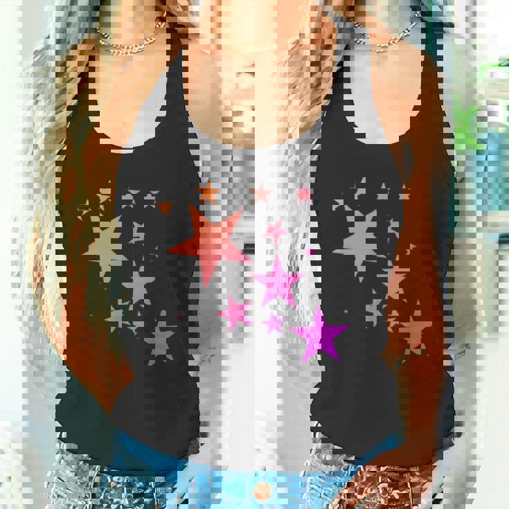 カラフルなオレンジピンクの星、流れ星柄デザイン。 タンクトップ