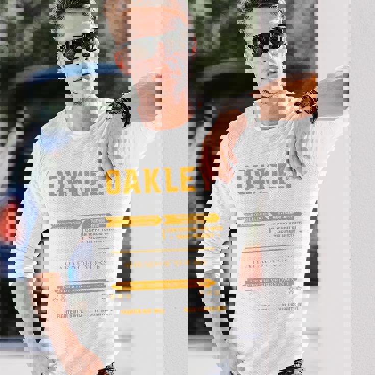 Oakleyオークリー 完全訳不明なネームシャツ フロントプリント 1Kana 長袖tシャツ 長袖Tシャツ 彼への贈り物