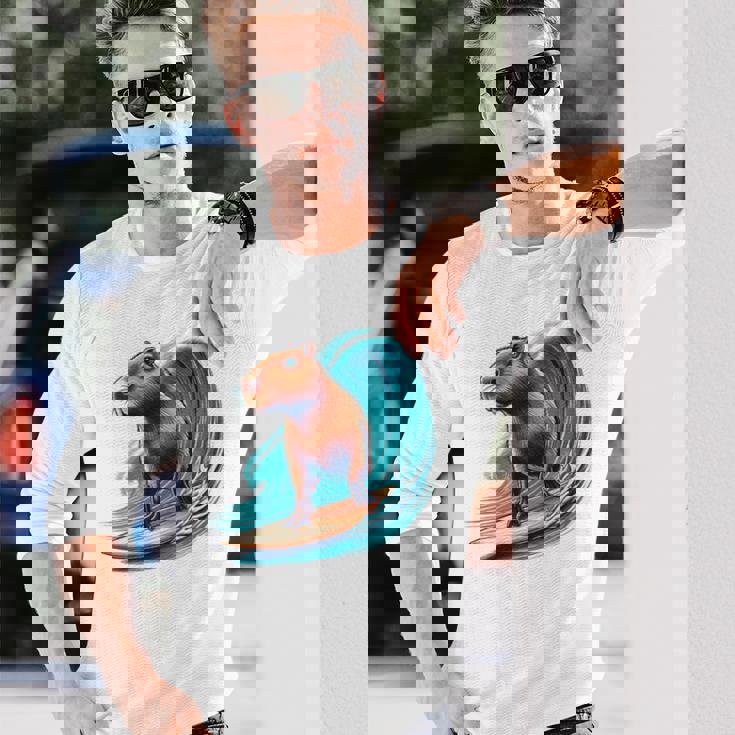 カッコイイ カピバラ サーファー サーフボード サーフィン メンズ レディース キッズ キャピー 長袖Tシャツ 彼への贈り物