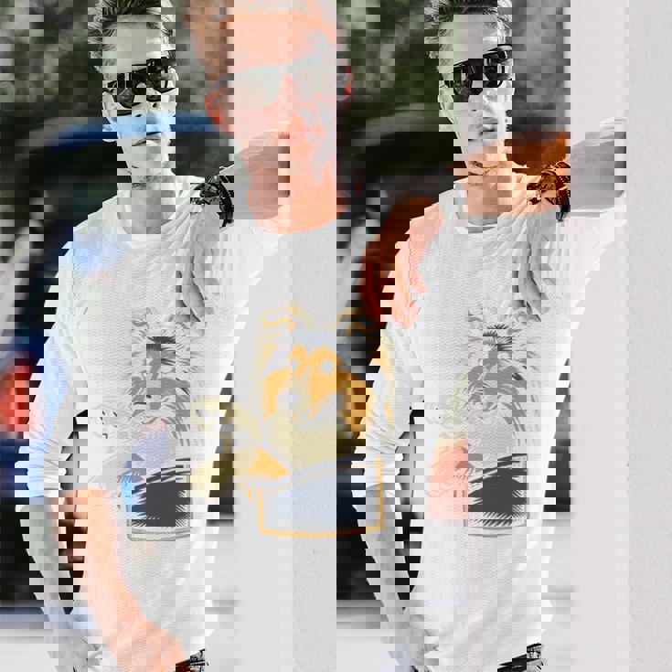 シェルティのグラフィック デザインを覗くかわいいシェットランド ・ シープドッグ 長袖tシャツ 長袖Tシャツ 彼への贈り物