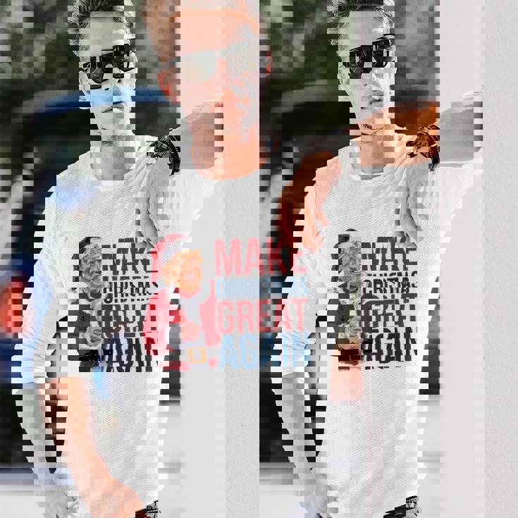 面白いクリスマスグレートアゲイントランプサンタファンusaホリデー 2024 長袖Tシャツ 彼への贈り物