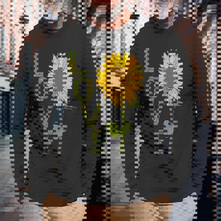 愛の大きなひまわりを作る庭師 長袖Tシャツ 高齢者への贈り物