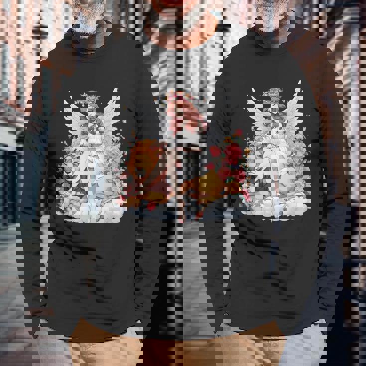 花に囲まれたライオンの天使 美しい天使 長袖Tシャツ 高齢者への贈り物