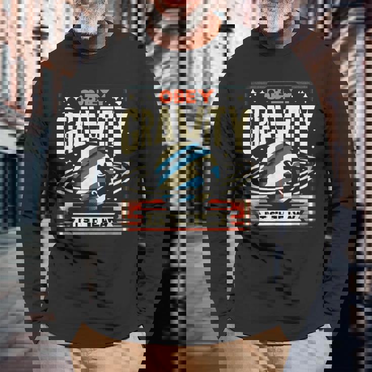 重力に従いなさい、それが法です Obey Gravity It's The Law 長袖Tシャツ 高齢者への贈り物