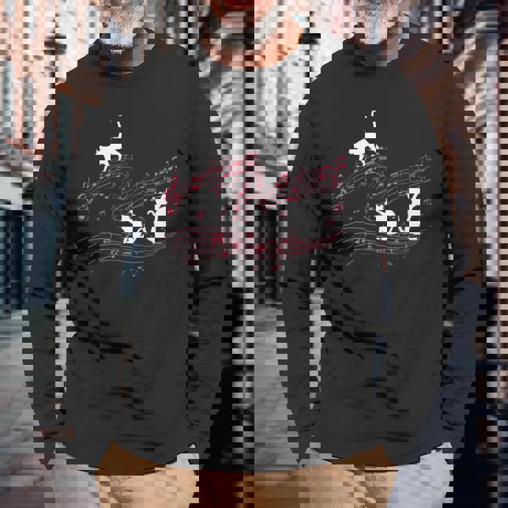 音符で遊ぶ3匹の猫 楽譜 長袖Tシャツ 高齢者への贈り物