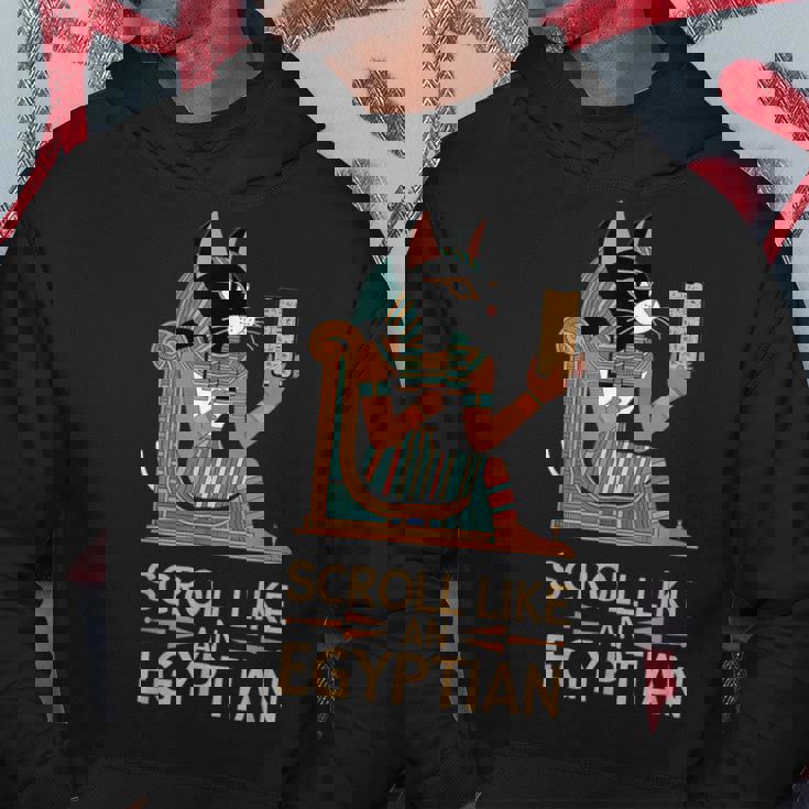 エジプトの猫のようなスクロールデザイン。 パーカー 面白い贈り物