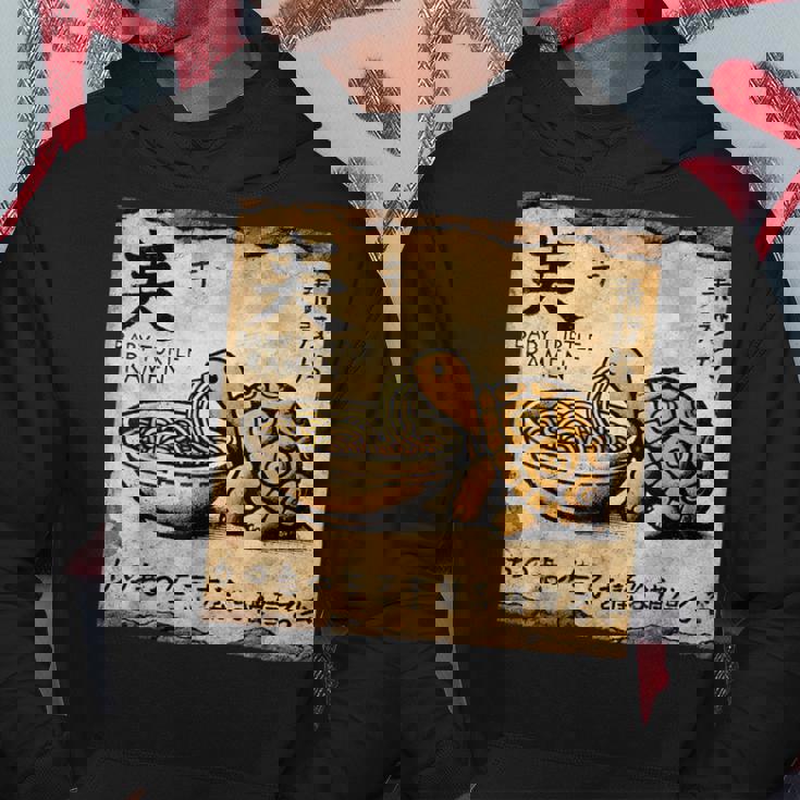 日本の古典的な洞窟石アートベビータートルラーメン パーカー 面白い贈り物