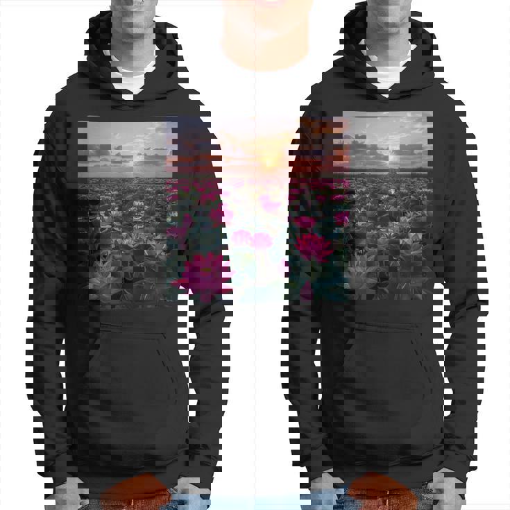 蓮の花畑 美しい夕日のグラフィック パーカー