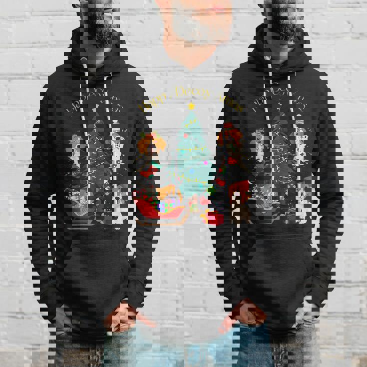 アグリー ハッピーデコピンクリスマス コーイケルホンディエ犬 ダッチデコイスパニエル犬 パーカー 彼への贈り物