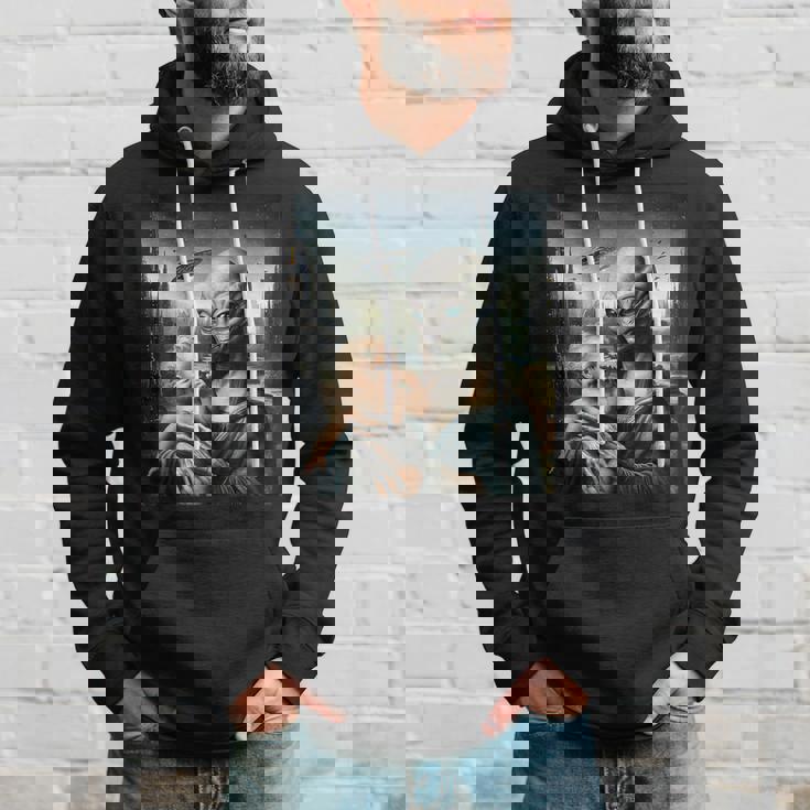 エイリアンホールディングヒューマンベイビーufo地球外接触tシャツ パーカー 彼への贈り物