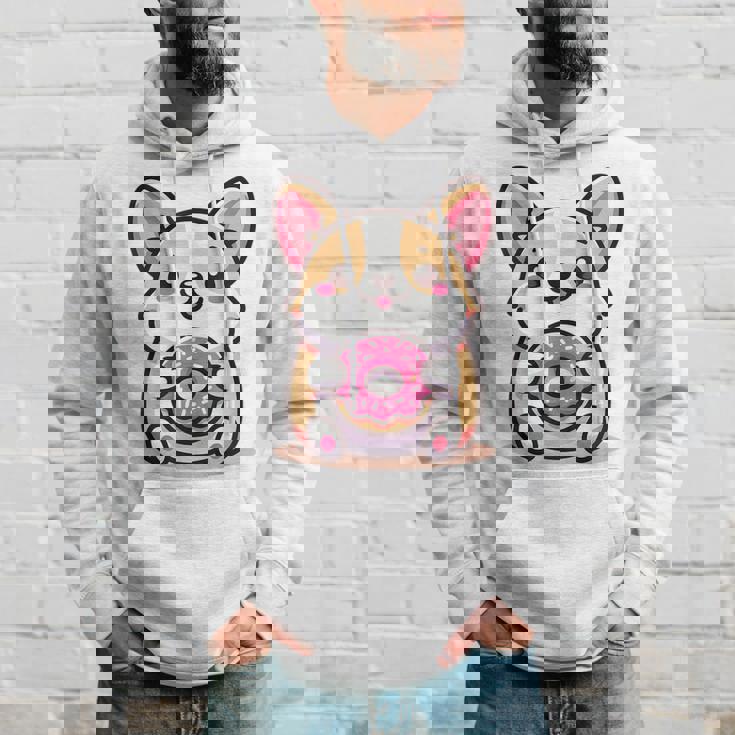 かわいいコーギーのドーナツを持つ漫画の犬愛好家アートキッズ。 パーカー 彼への贈り物