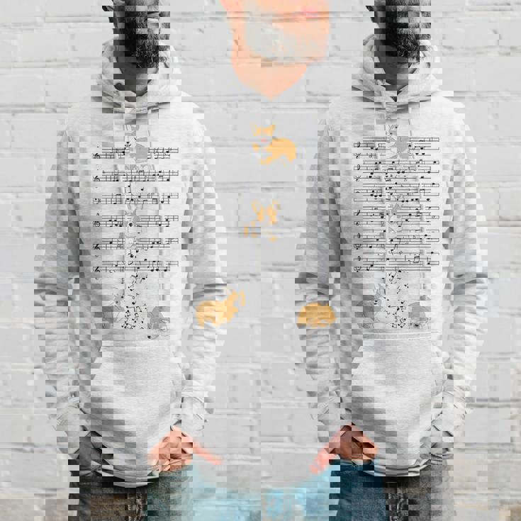 コーギー 犬 音符 音符 ミュージシャン かわいい コーギー 犬 パーカー 彼への贈り物