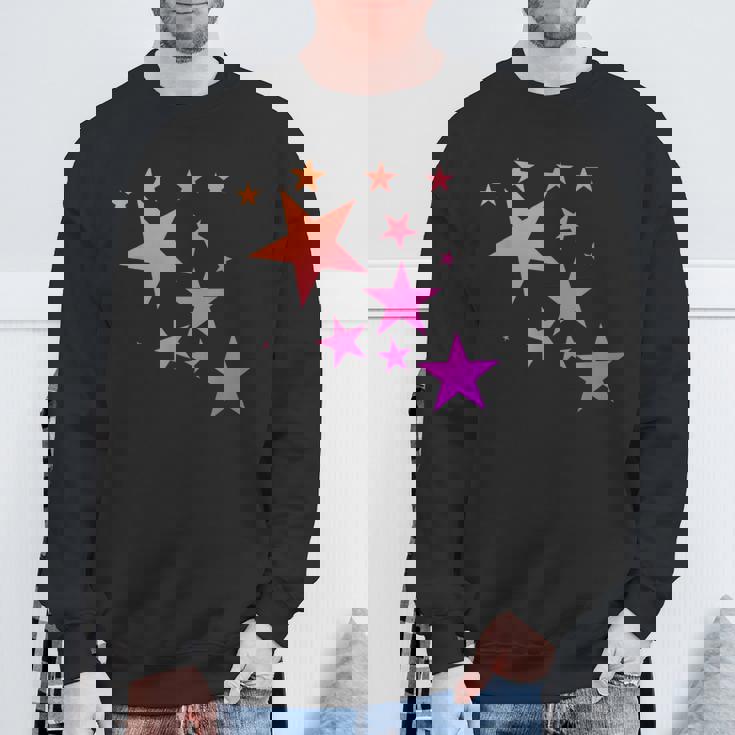 カラフルなオレンジピンクの星、流れ星柄デザイン。 スウェットシャツ 高齢者への贈り物