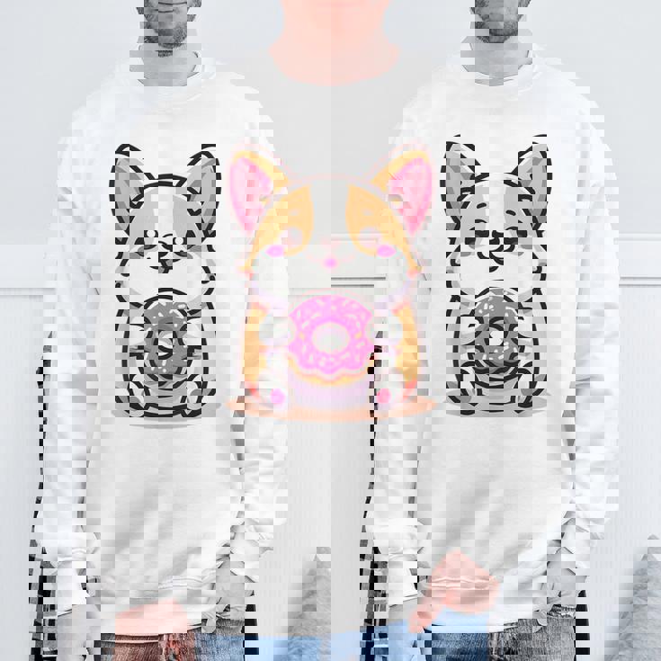 かわいいコーギーのドーナツを持つ漫画の犬愛好家アートキッズ。 スウェットシャツ 高齢者への贈り物