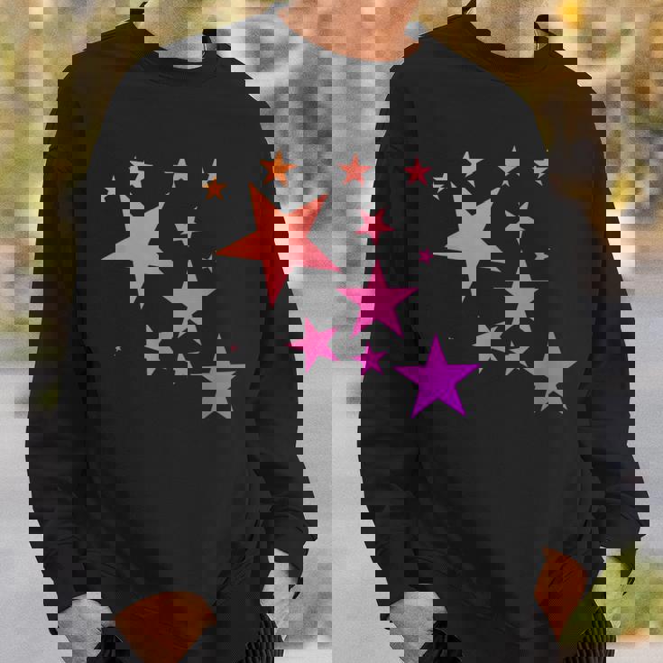 カラフルなオレンジピンクの星、流れ星柄デザイン。 スウェットシャツ 彼への贈り物