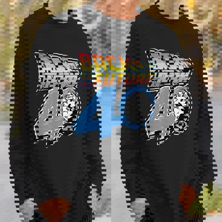 バック・トゥ・ザ・フューチャー 40周年記念時計塔ロゴ スウェットシャツ 彼への贈り物