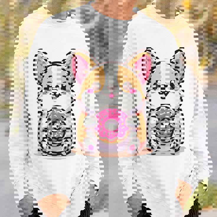 かわいいコーギーのドーナツを持つ漫画の犬愛好家アートキッズ。 スウェットシャツ 彼への贈り物