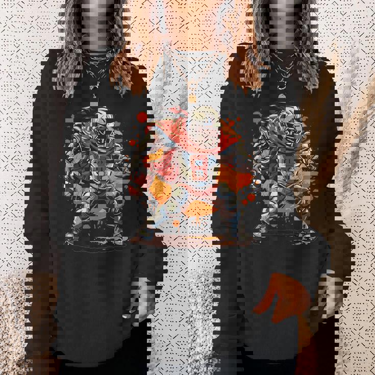 アメリカンフットボールのコスチュームを着たストロングナイト。 スウェットシャツ 彼女への贈り物