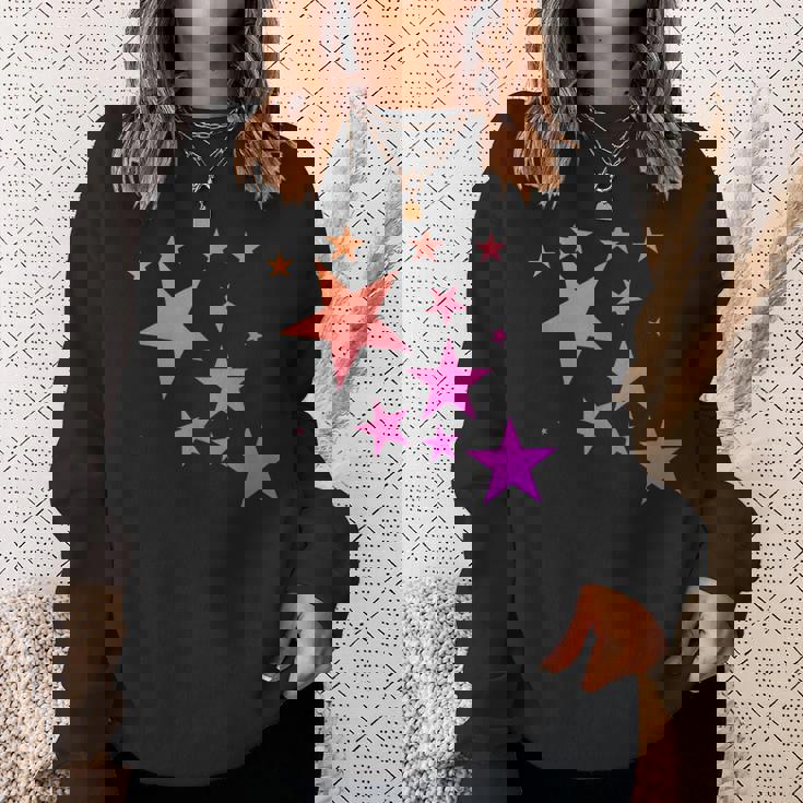 カラフルなオレンジピンクの星、流れ星柄デザイン。 スウェットシャツ 彼女への贈り物