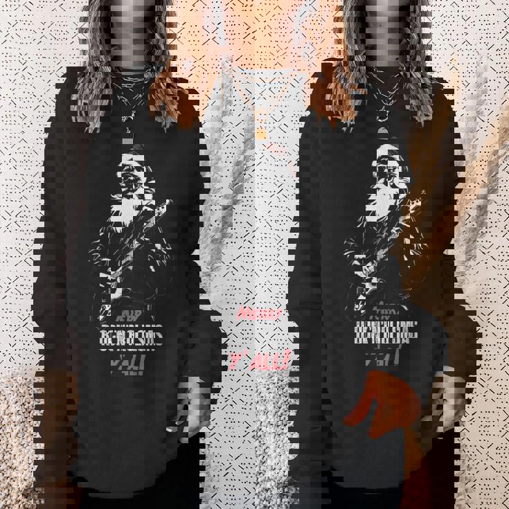 ヘヴィメタルのクリスマス、ギターを弾くサンタ スウェットシャツ 彼女への贈り物