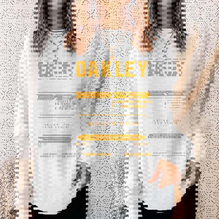 Oakleyオークリー 完全訳不明なネームシャツ フロントプリント 1Kana 長袖tシャツ スウェットシャツ 彼女への贈り物