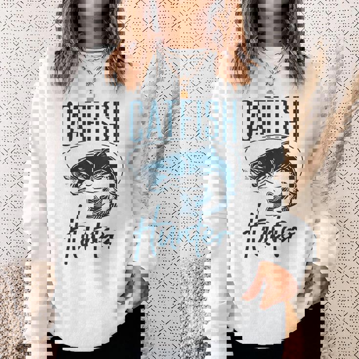 かわいいナマズハンターデザイン ナマズ農家へのギフトアイデア スウェットシャツ 彼女への贈り物