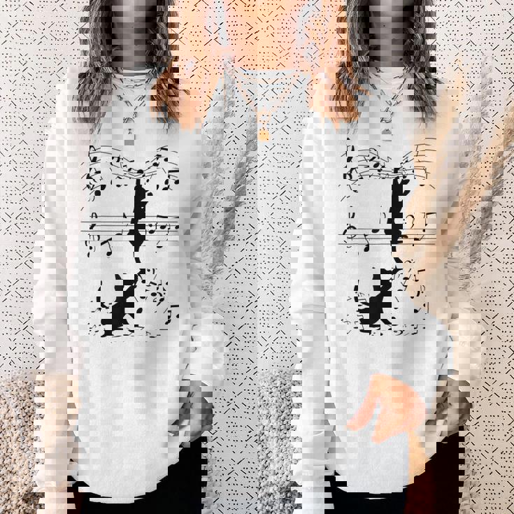 楽譜で遊ぶ面白い猫 スウェットシャツ 彼女への贈り物