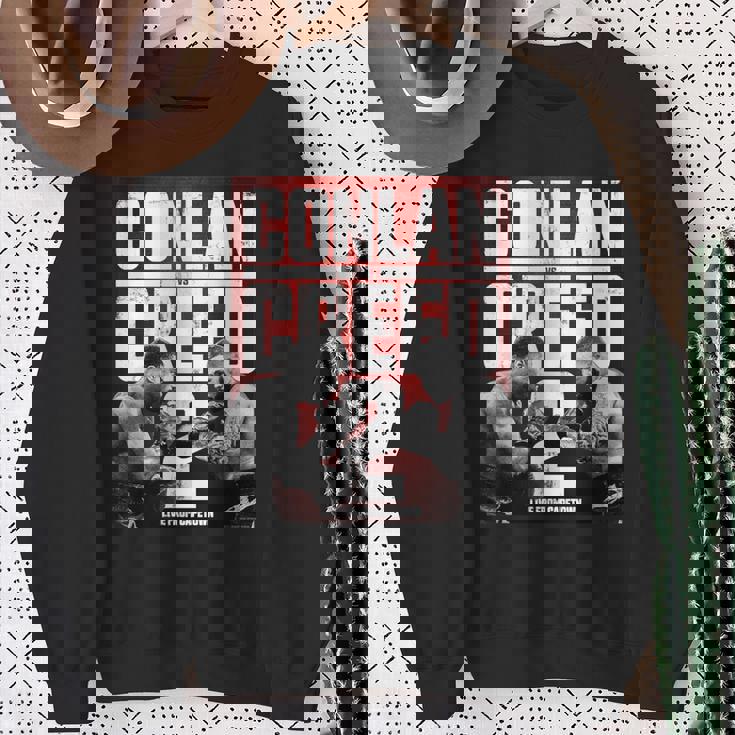 アドニスクリード—ケープタウンからのコンラン対クリード2ライブ スウェットシャツ 年配の女性への贈り物