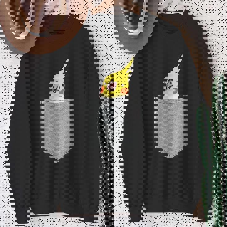 ポケットから覗くオカメインコのデザイン スウェットシャツ 年配の女性への贈り物