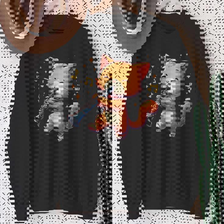 猫好きのためのかわいい猫のデザイン 猫がクラリネットを弾く スウェットシャツ 年配の女性への贈り物