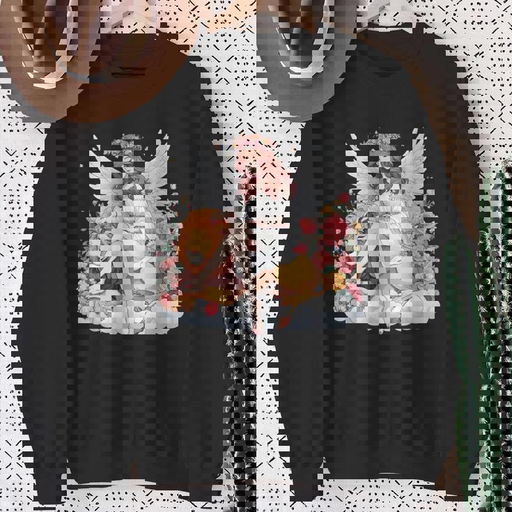 花に囲まれたライオンの天使 美しい天使 スウェットシャツ 年配の女性への贈り物