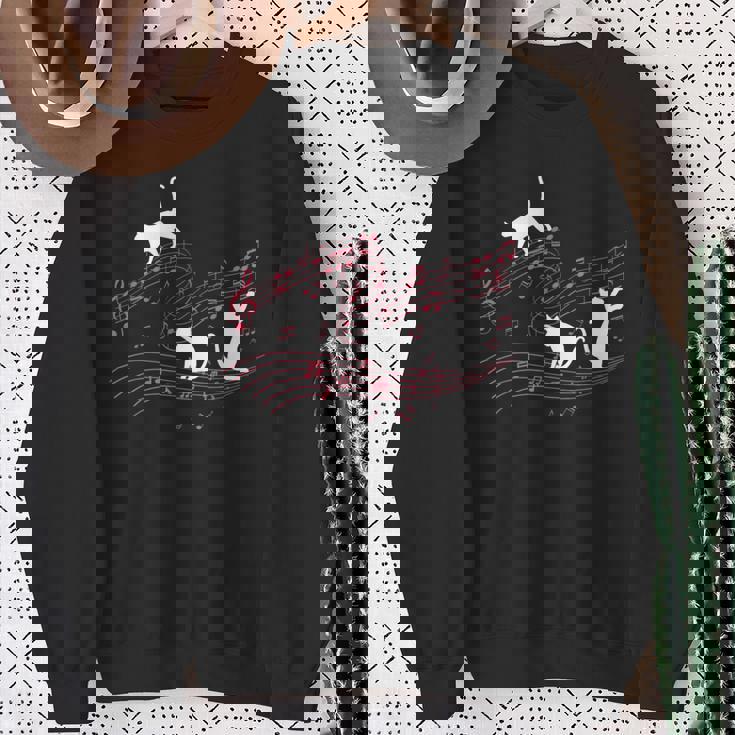 音符で遊ぶ3匹の猫 楽譜 スウェットシャツ 年配の女性への贈り物