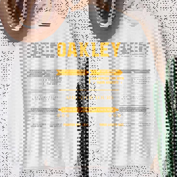 Oakleyオークリー 完全訳不明なネームシャツ フロントプリント 1Kana 長袖tシャツ スウェットシャツ 年配の女性への贈り物