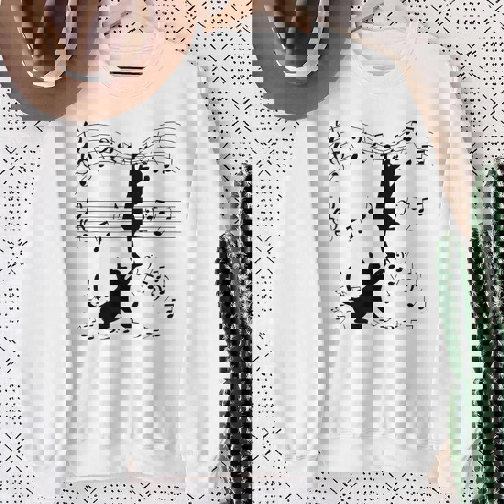 楽譜で遊ぶ面白い猫 スウェットシャツ 年配の女性への贈り物