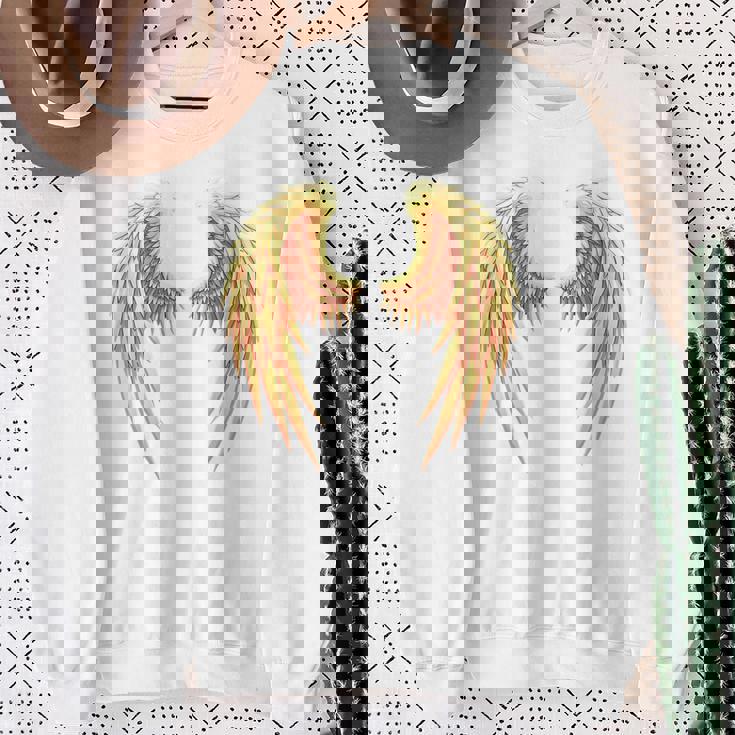 背中には金色の天使の羽 スウェットシャツ 年配の女性への贈り物