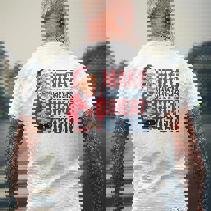 面白いクリスマスグレートアゲイントランプサンタファンusaホリデー 2024 メンズTシャツ バックプリント 高齢者への贈り物