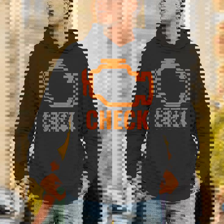 オレンジ色の車のエンジンダッシュボード警告灯 面白いメカニック。 パーカー