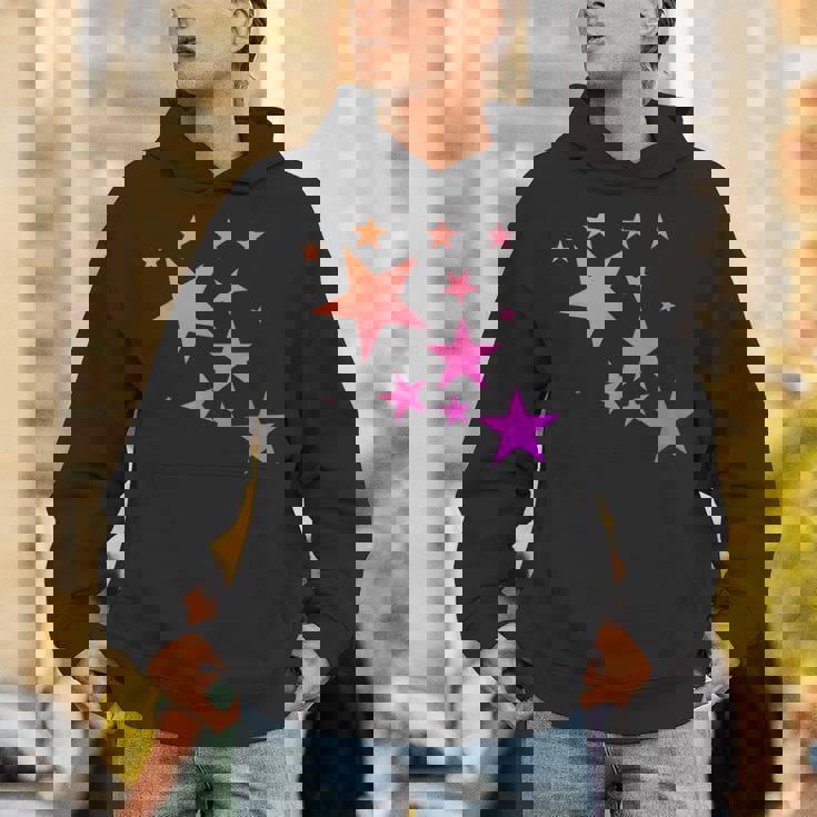 カラフルなオレンジピンクの星、流れ星柄デザイン。 Hoodie