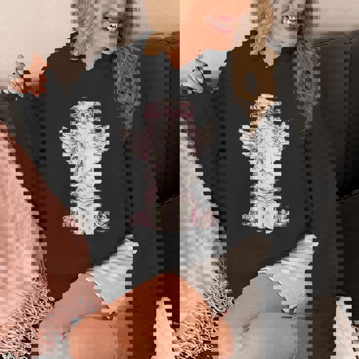 天使の羽を持つ膝の上の美的天使を祈る Hoodie