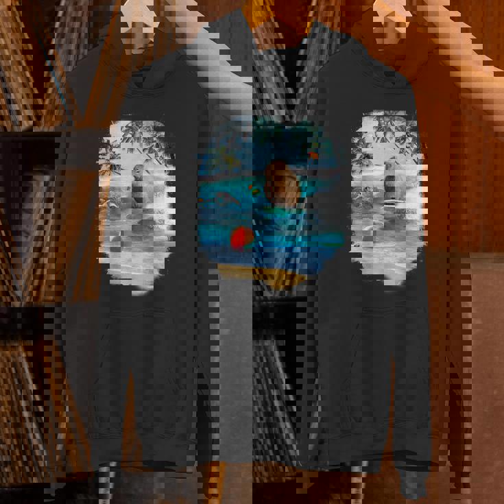 ビーチでのカピバラサーフィンおかしい パーカー