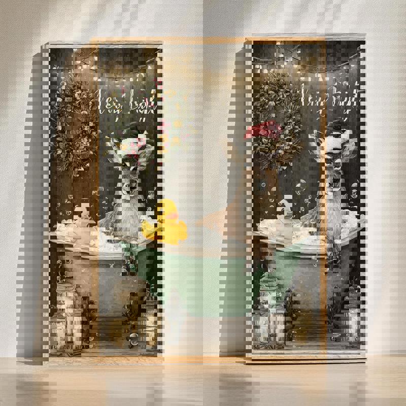 Farmhouse reindeer canvas featuring a whimsical reindeer soaking in a vintage bathtub, bathroom wall art in neutral tones | Familywalldecor